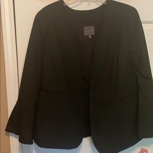 Black blazer with trumpet sleeve.